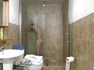 A juvenile man is taking a shower then receives out of it and wipes with a white towel. That stud sits down in his chair and starts to jerk off. That stud ejaculates on his abdomen, then wipes it off like it not at any time happened.